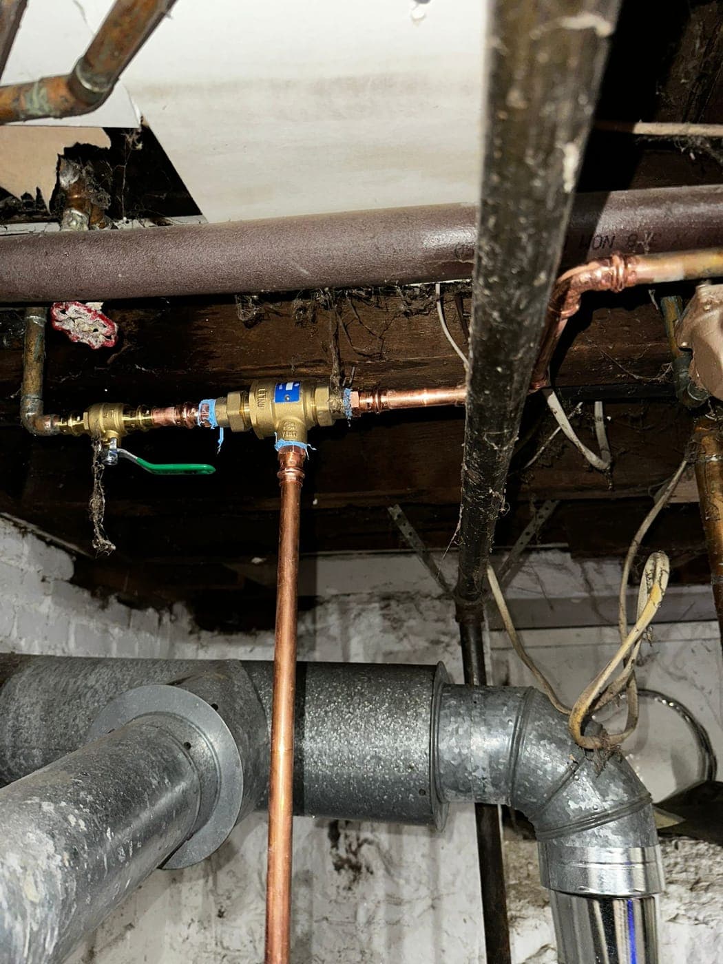 Copper water line with ball valves near the meter in a North Jersey basement