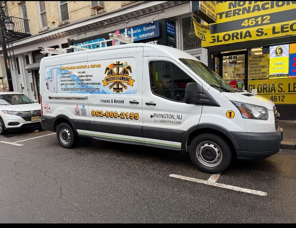 Master's Plumbing service van parked on a busy street