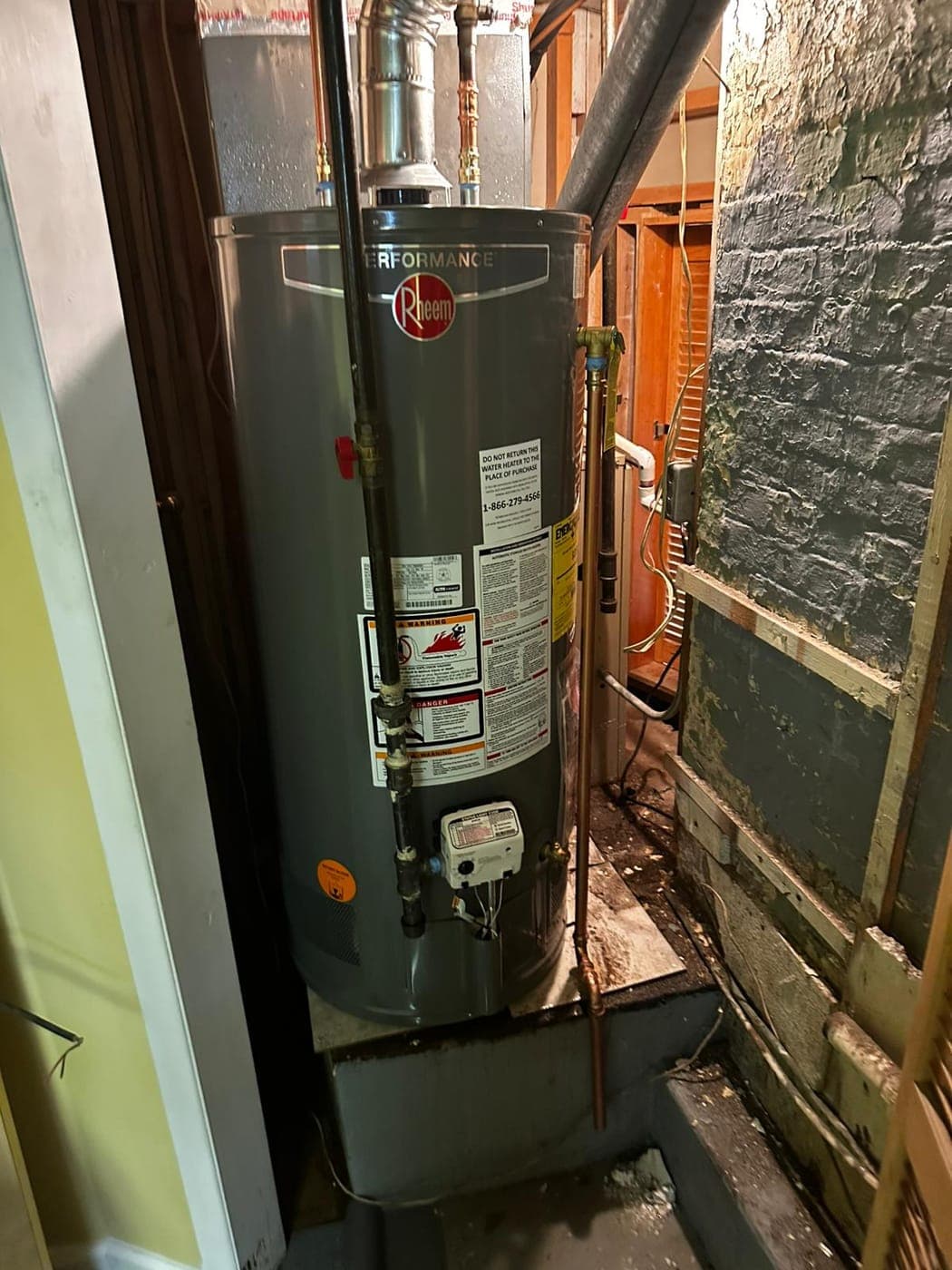New Rheem gas water heater installed by Master's Plumbing in a North Jersey basement